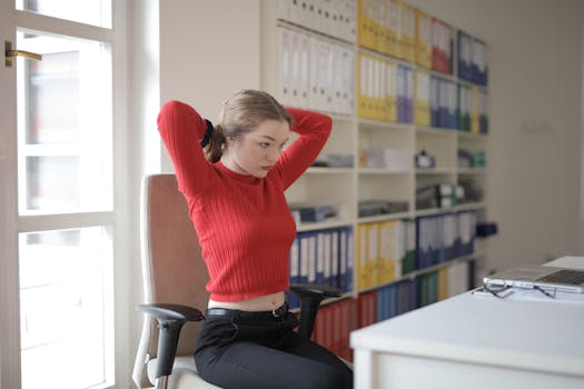 a person stretching at their desk