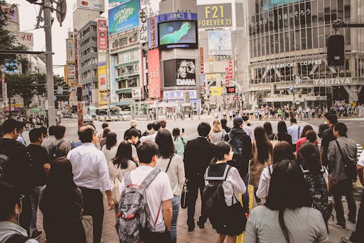 a busy Tokyo street illustrating work culture